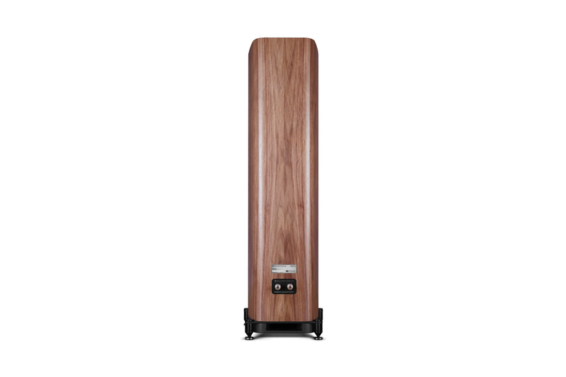 Back of a wooden floor-standing speaker on a white background