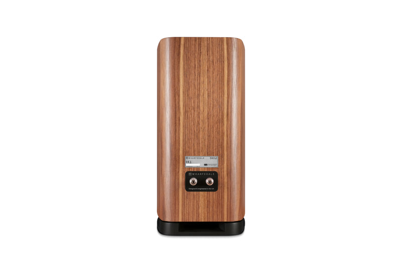 Back of a wooden bookshelf speaker on a white background
