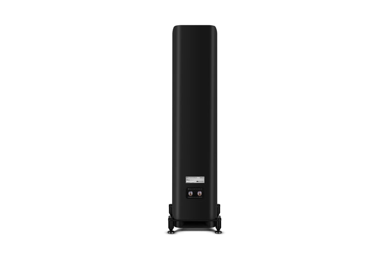 Back of a black floor-standing speaker on a white background
