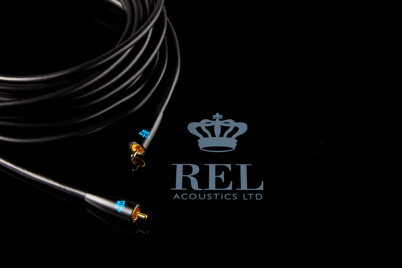 Coiled cable with connectors on a black background featuring REL Acoustics Ltd logo.