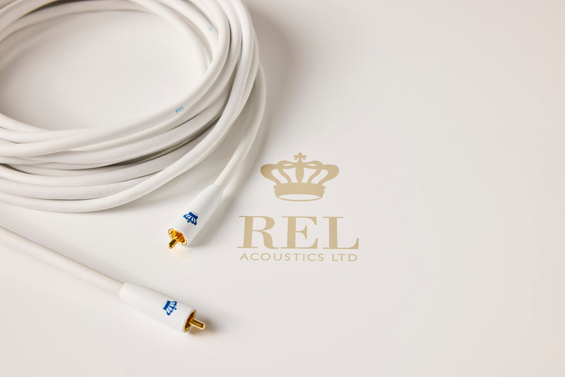 White audio cable with gold connectors on a light grey background, featuring the REL Acoustics Ltd logo.