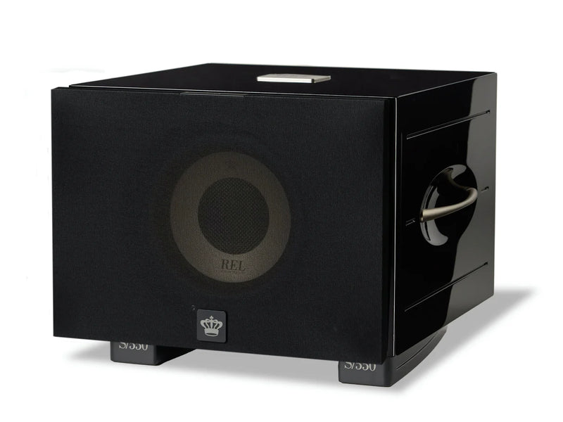 Black subwoofer with REL branding and a cloth cover on a white background